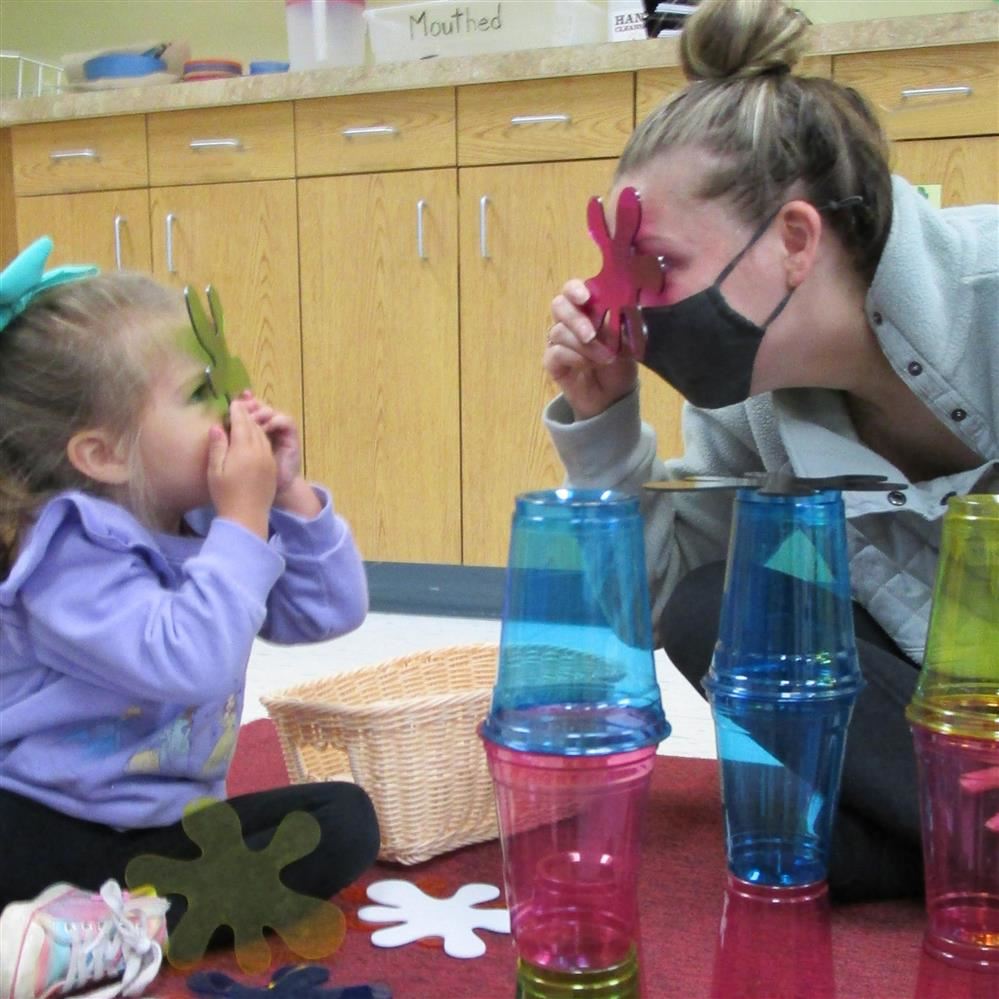  child and woman playing